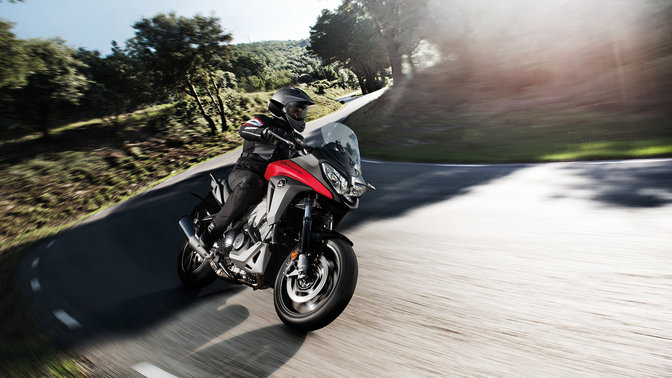 Front 3-quarter view of NC700X with rider.