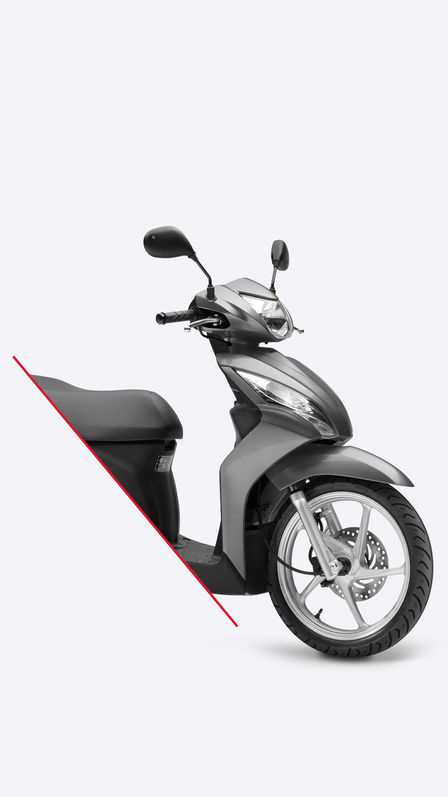 Bočný pohľad na sivý skúter Vision scooter, obrázok je orezaný tak, aby zobrazoval len prednú polovicu.